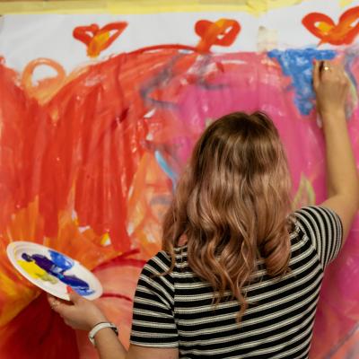 Person painting mural